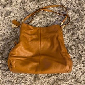 Coach tan satchel purse with zipper and magnet closures